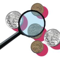 Magnifying glass with coins