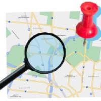 Map with magnifying glass and pin