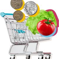 Shopping trolley with food and coins in it